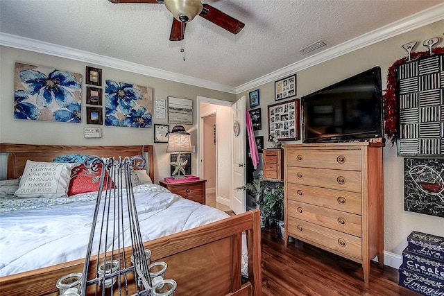 bedroom featuring crown molding, dark wood-type flooring, ceiling fan, and a textured ceiling