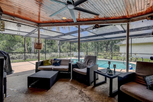 exterior space featuring a lanai, an outdoor hangout area, and ceiling fan