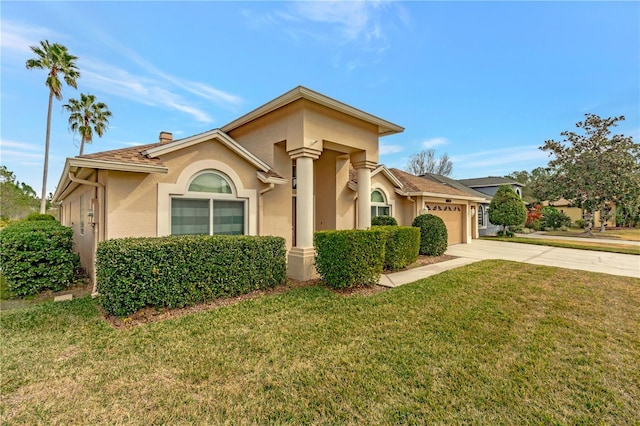 view of front of home with a garage and a front yard