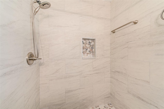 full bathroom with tiled shower