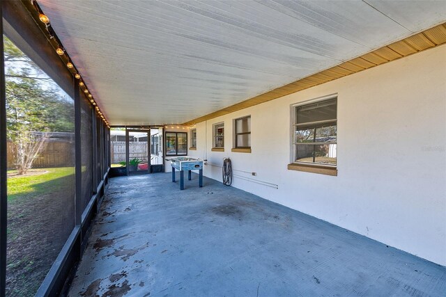 unfurnished sunroom with a healthy amount of sunlight