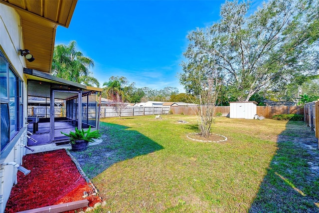 view of yard with an outdoor structure, a storage shed, and a fenced backyard