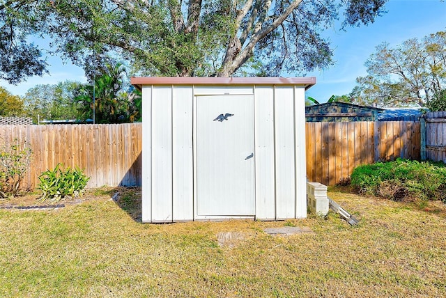 view of shed featuring a fenced backyard