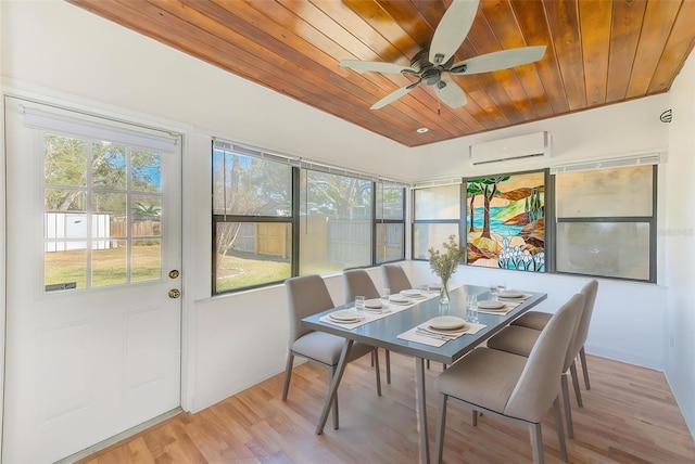 dining room with light wood finished floors, wooden ceiling, a ceiling fan, and a wall mounted AC