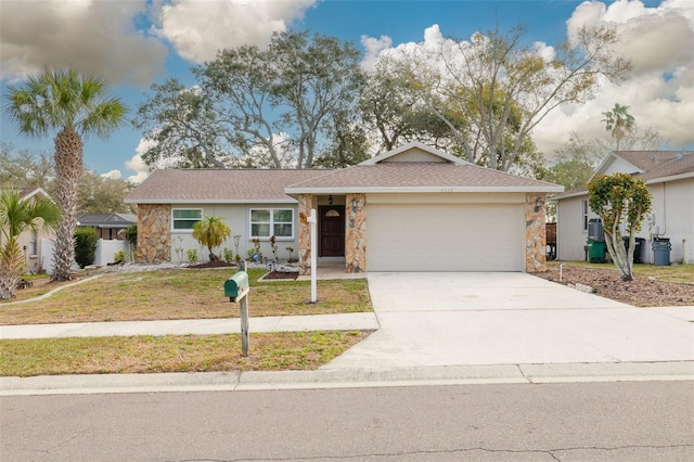 ranch-style house featuring a garage and a front yard