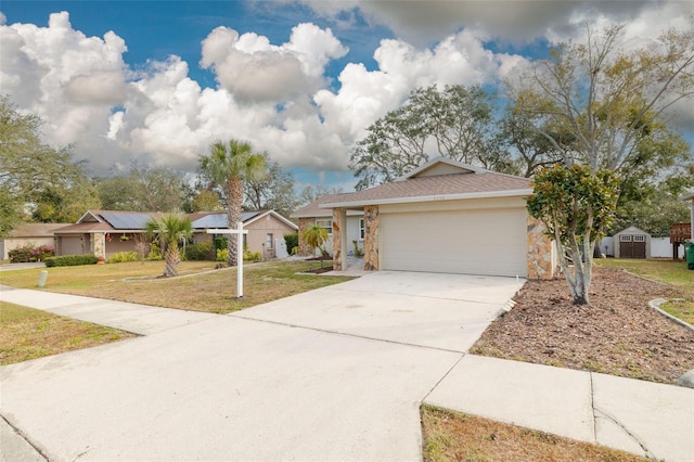 single story home featuring a garage and a front yard