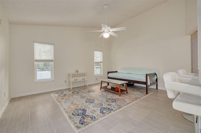 bedroom featuring multiple windows, high vaulted ceiling, and ceiling fan