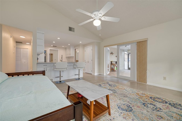 living room with high vaulted ceiling and ceiling fan