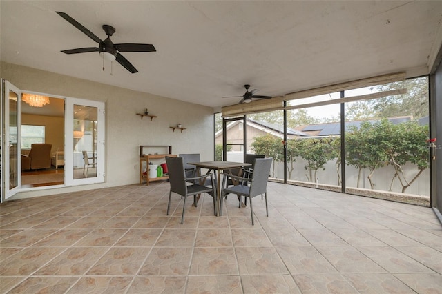 sunroom / solarium featuring a wealth of natural light and ceiling fan