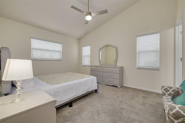 carpeted bedroom featuring vaulted ceiling and ceiling fan