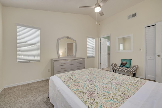 bedroom with lofted ceiling, light colored carpet, and ceiling fan