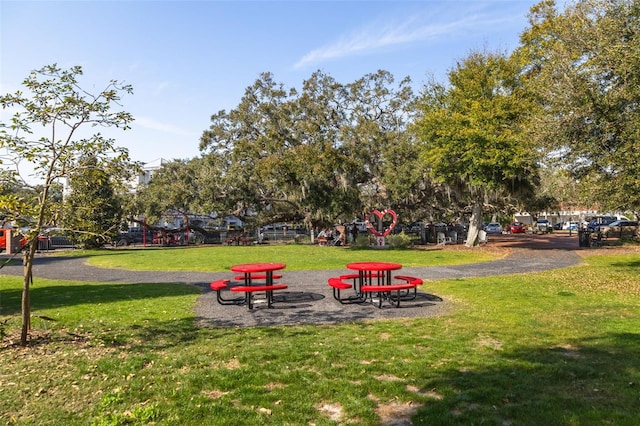 view of property's community with a yard