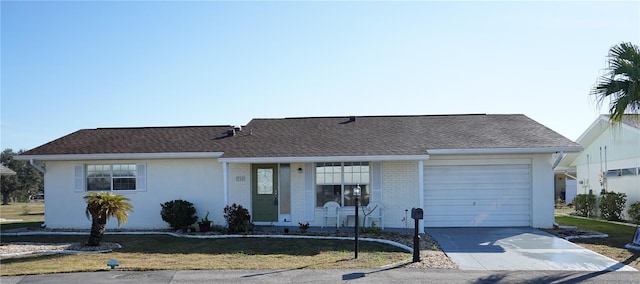 ranch-style house featuring a garage