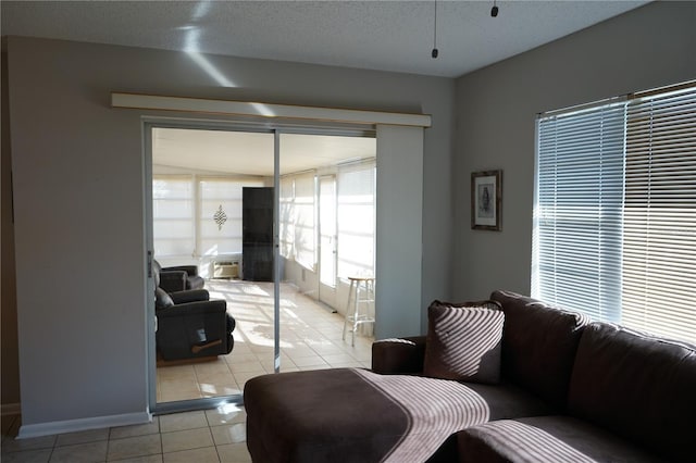 tiled living room with a textured ceiling