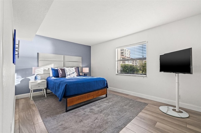 bedroom with light hardwood / wood-style flooring