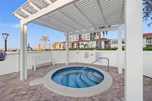 view of swimming pool with a pergola, a patio area, and a hot tub