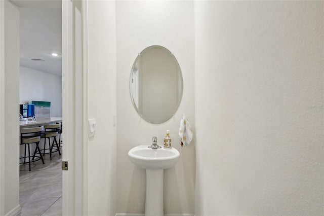 bathroom with tile patterned floors