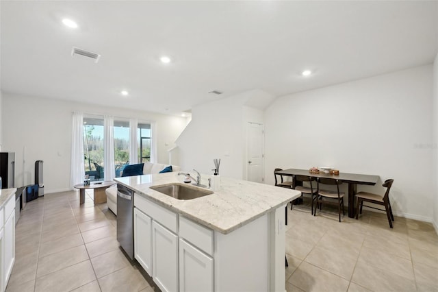 kitchen with sink, white cabinetry, light stone counters, an island with sink, and stainless steel dishwasher