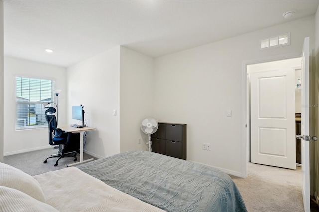 bedroom featuring light colored carpet