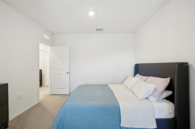 bedroom featuring light carpet