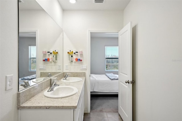 bathroom featuring tile patterned flooring and vanity