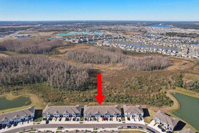 birds eye view of property featuring a water view