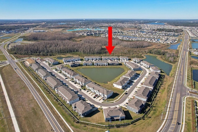 birds eye view of property featuring a water view