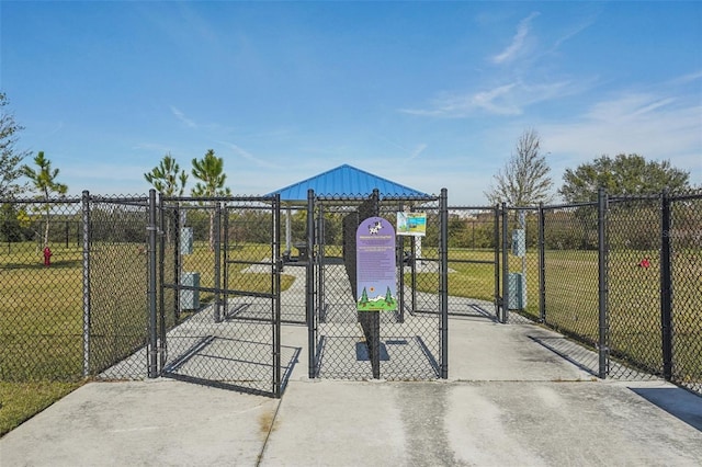 view of gate featuring a lawn