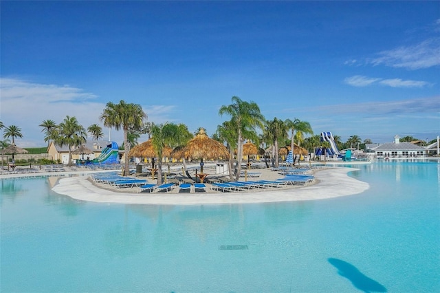 view of swimming pool featuring a water view