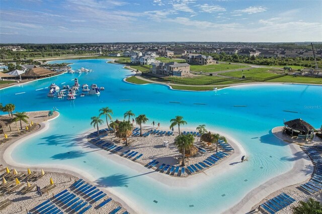 bird's eye view with a beach view and a water view