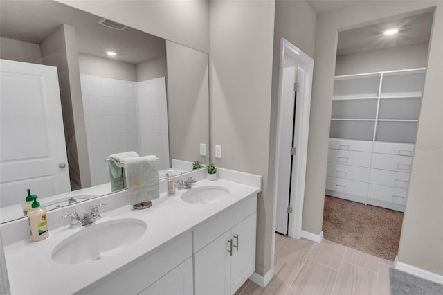 bathroom with vanity and walk in shower