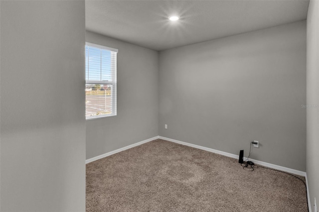 empty room with carpet flooring