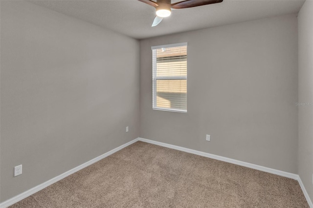 unfurnished room featuring carpet floors and ceiling fan