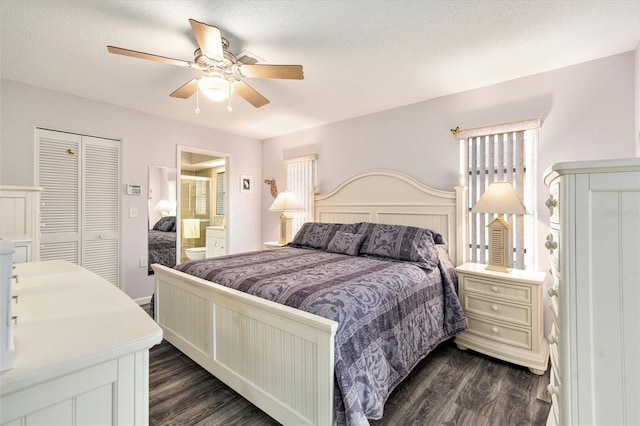 bedroom with ceiling fan, dark wood-type flooring, a textured ceiling, and ensuite bathroom