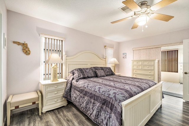 bedroom featuring ceiling fan and hardwood / wood-style floors