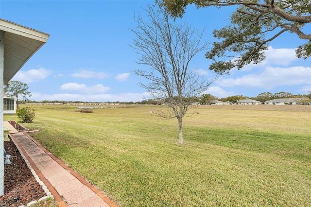 view of yard with a rural view