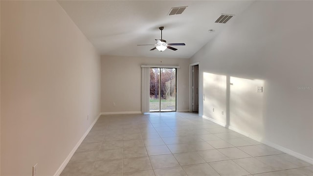 tiled spare room with lofted ceiling and ceiling fan