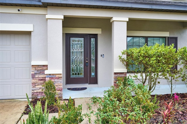 view of exterior entry featuring a porch