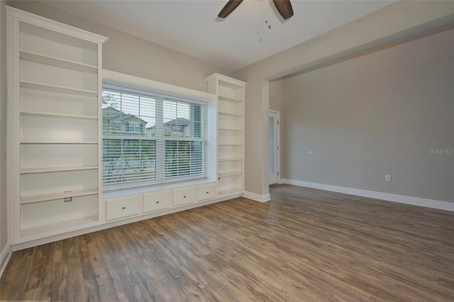 unfurnished living room with ceiling fan and wood-type flooring