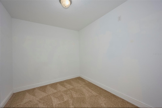 empty room with carpet flooring