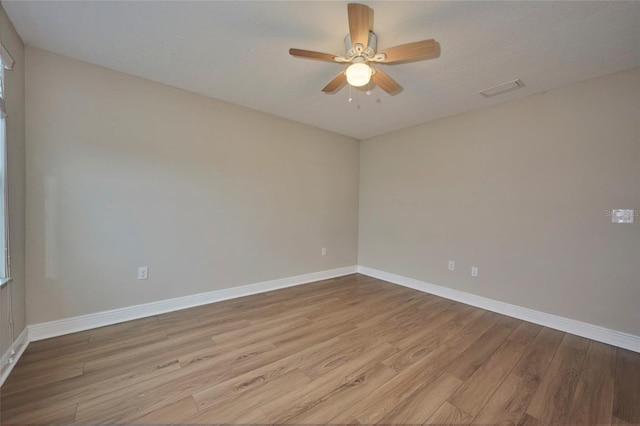 unfurnished room with ceiling fan and light hardwood / wood-style flooring