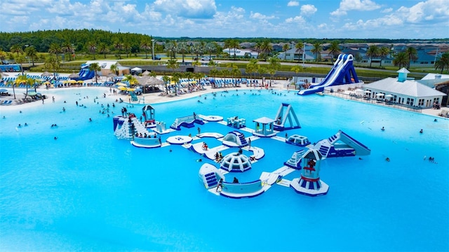 view of pool with a water slide