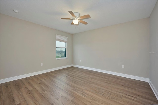 unfurnished room with light hardwood / wood-style flooring and ceiling fan