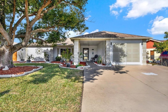 view of front facade with a garage and a front yard