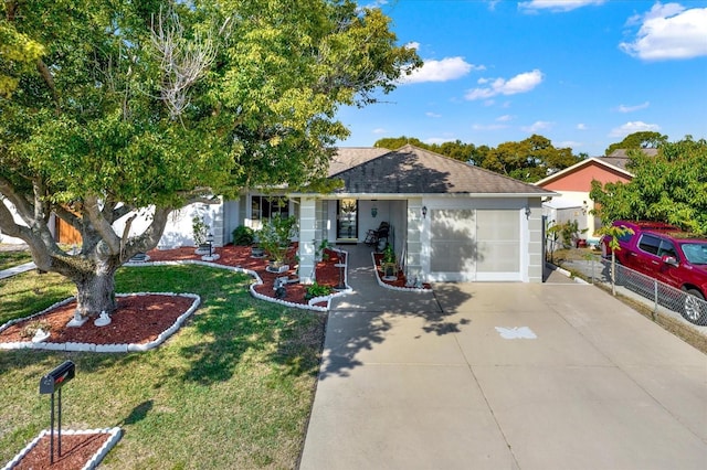 view of front of home with a garage and a front yard