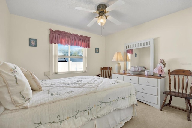 bedroom with light carpet and ceiling fan