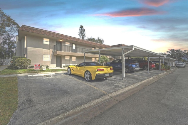 view of partially covered parking lot
