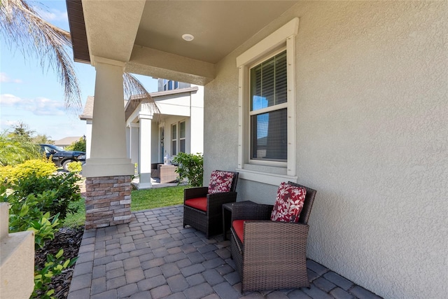 view of patio featuring a porch