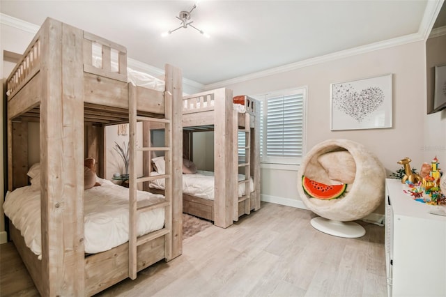 bedroom with light hardwood / wood-style flooring and ornamental molding