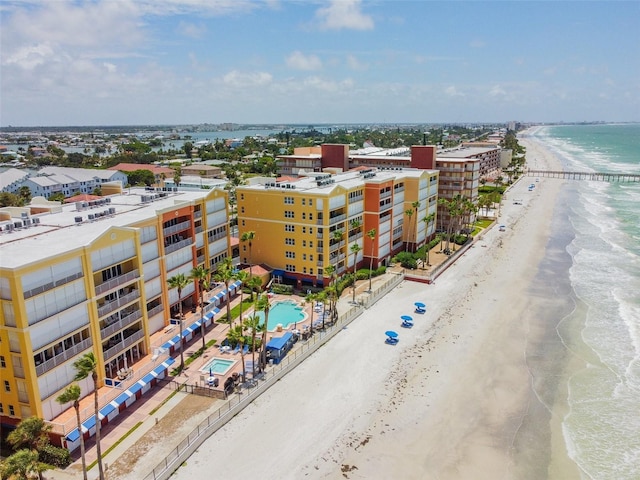 bird's eye view with a water view and a beach view